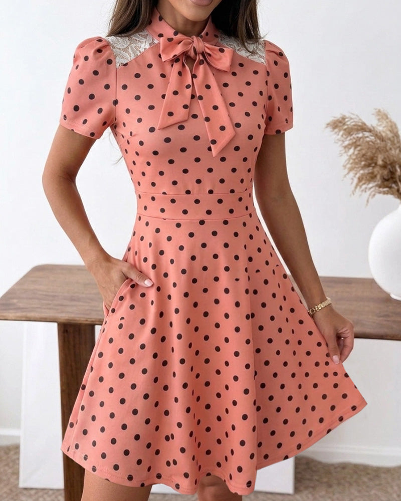 Vestido de línea A con lunares para mujer, estilo vintage, cuello con lazo, mangas abullonadas, detalles de encaje y bolsillos