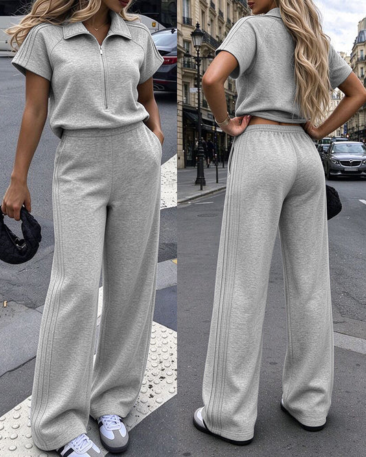 Lässiger Damen-Jumpsuit mit halbem Reißverschluss, kurzen Ärmeln, hoher Taille, weitem Bein und Taschen