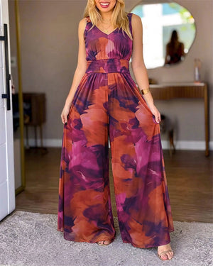Mono de malla con estampado tie-dye para mujer, cuello alto, escote en V, cintura fruncida, pierna ancha, espalda descubierta y sin mangas; con bolsillos