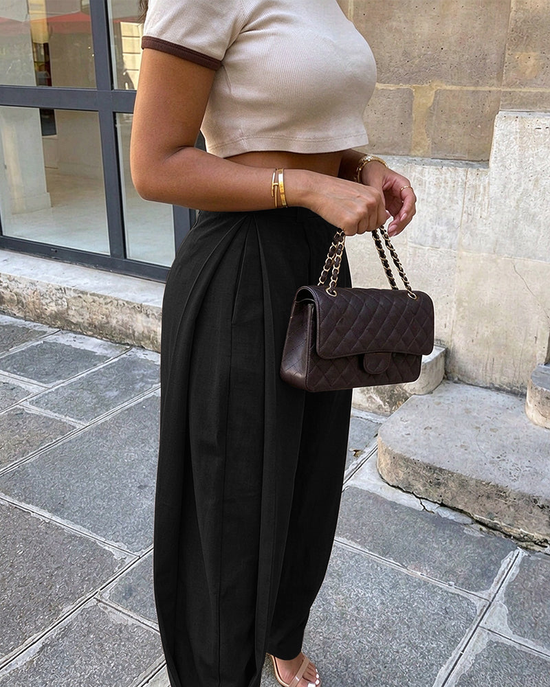 Pantalon sarouel femme taille haute à plis, poches et bas de jambes boutonnés