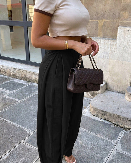Pantalon sarouel femme taille haute à plis, poches et bas de jambes boutonnés