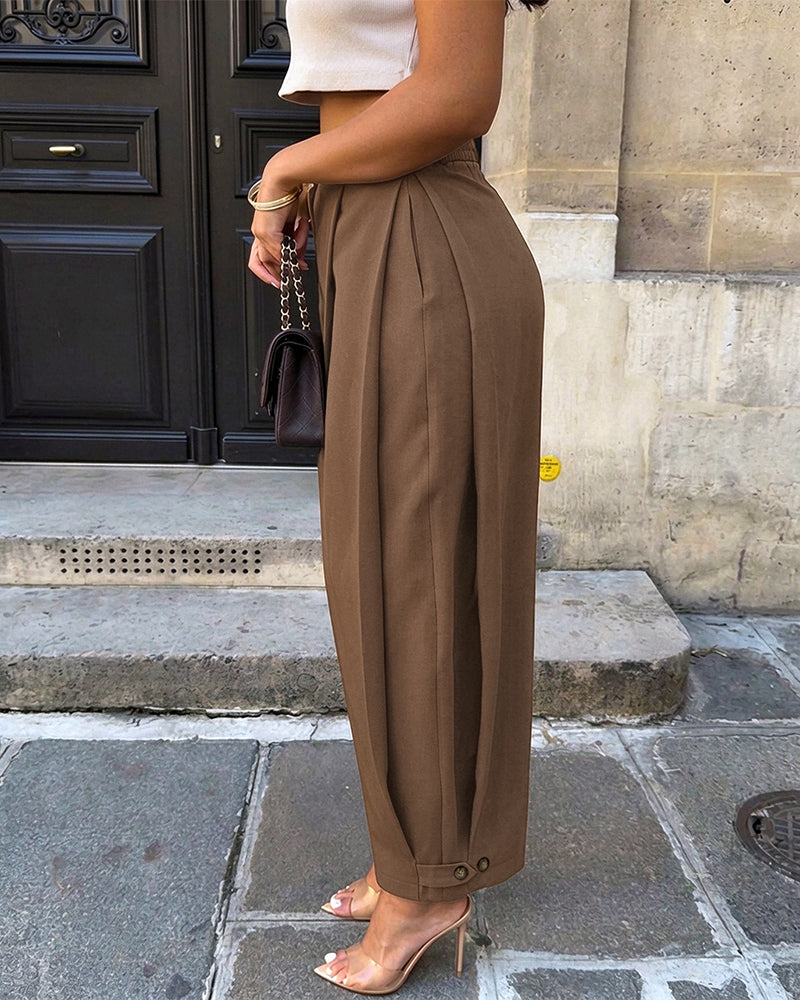 Pantalon sarouel femme taille haute à plis, poches et bas de jambes boutonnés