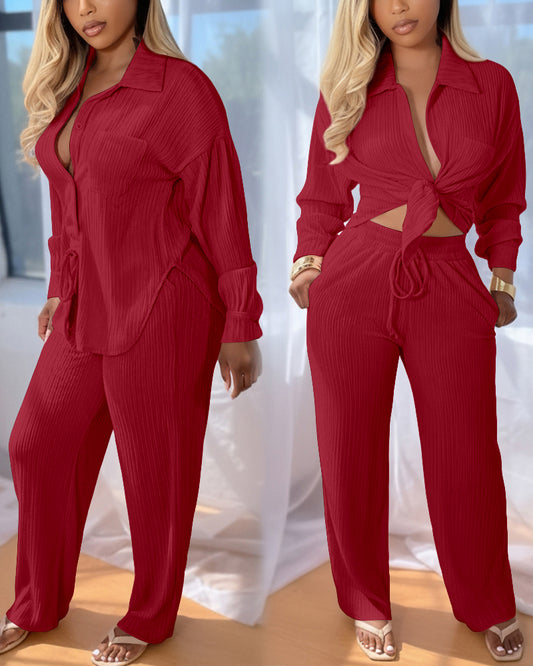 2-teiliges Outfit, Umlegekragen, Knopfleiste vorne, Taschendesign, asymmetrisches Saumoberteil und Kordelzug, elastische Taille, weites Bein, Hosenset, lässiges strukturiertes Set
